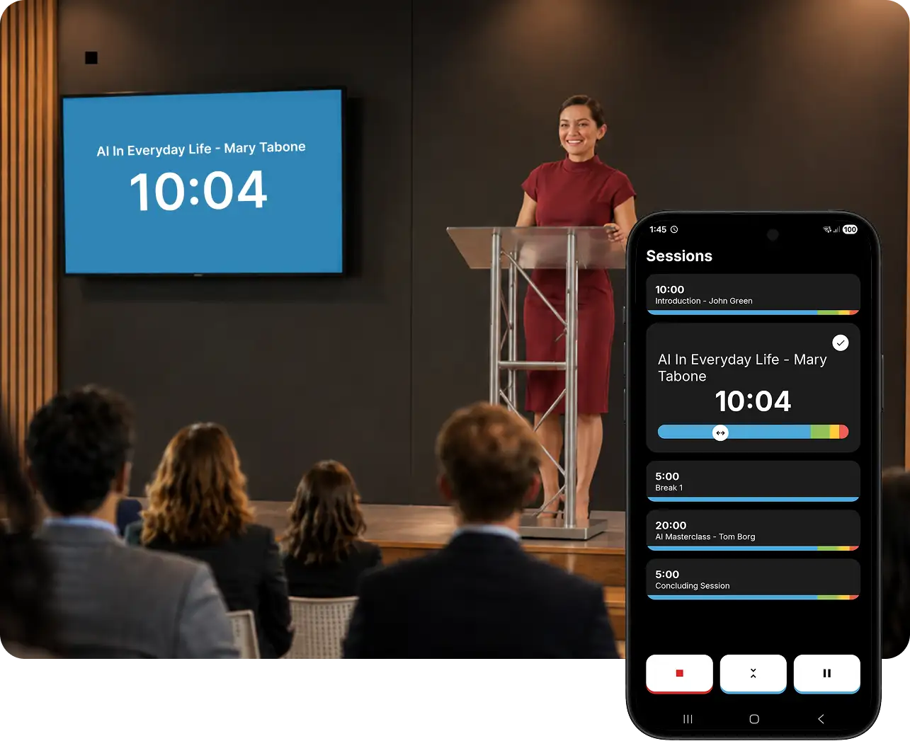 A presenter at a podium with her countdown cast to a TV screen behind her, next to a phone showing the same session list